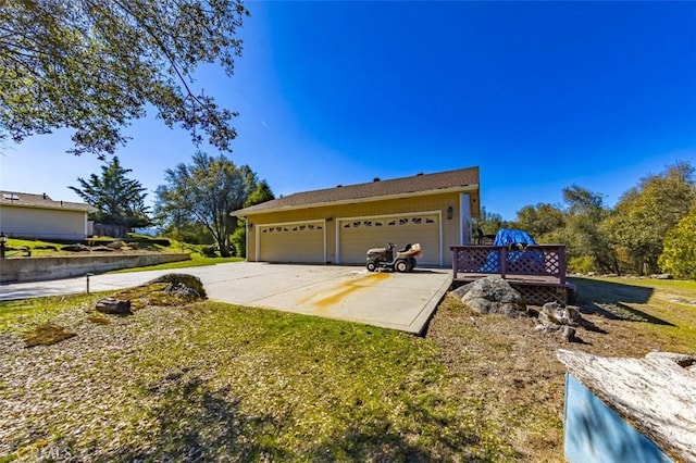 45544 Pine River Rd, Ahwahnee, CA 93601 - view of front of home with a garage, driveway, and a front lawn