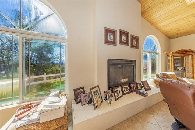 45544 Pine River Rd, Ahwahnee, CA 93601 - tiled living room with high vaulted ceiling, wooden ceiling, and a fireplace