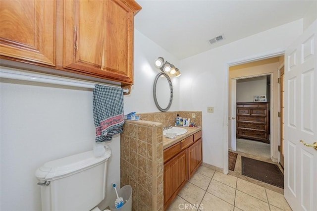 45544 Pine River Rd, Ahwahnee, CA 93601 - half bath with visible vents, vanity, toilet, and tile patterned floors