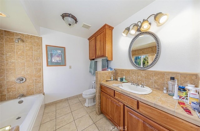 45544 Pine River Rd, Ahwahnee, CA 93601 - bathroom with tile patterned flooring, visible vents, vanity, and toilet