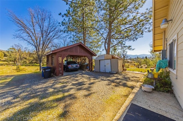 45544 Pine River Rd, Ahwahnee, CA 93601 - exterior space with gravel driveway, an outdoor structure, and a storage shed