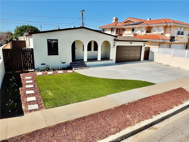 mediterranean / spanish house featuring concrete driveway, crawl space, fence, and stucco siding