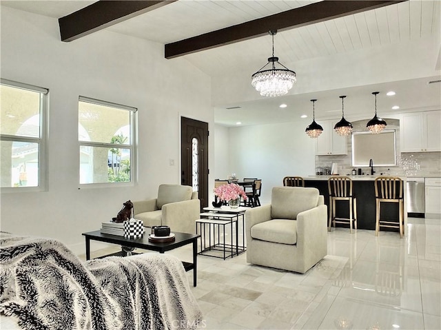living area with lofted ceiling with beams, a chandelier, and recessed lighting