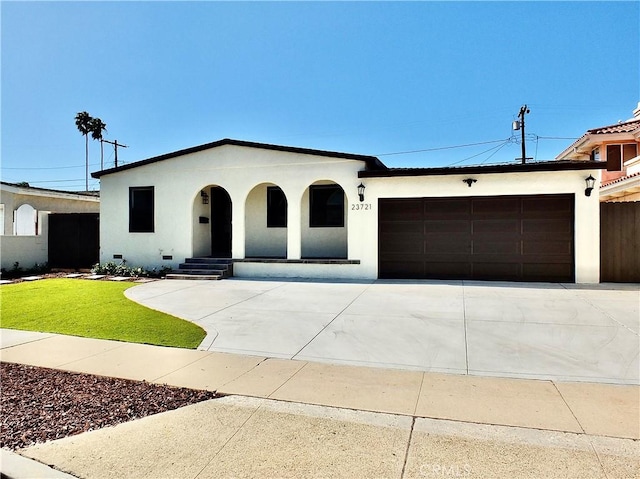 view of front of home featuring a garage, crawl space, driveway, and stucco siding
