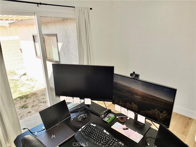 office space with wood finished floors