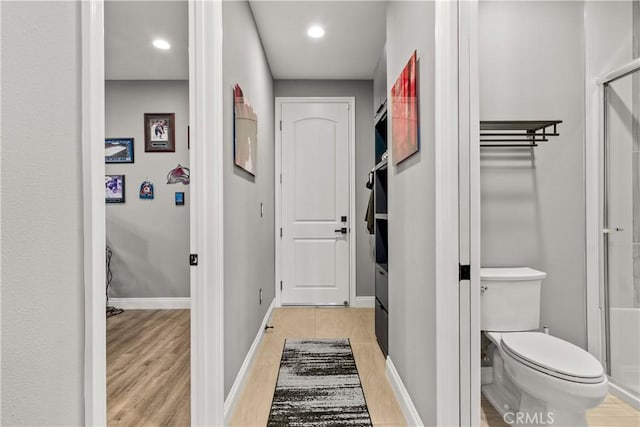 interior space featuring recessed lighting, baseboards, and light wood-style flooring