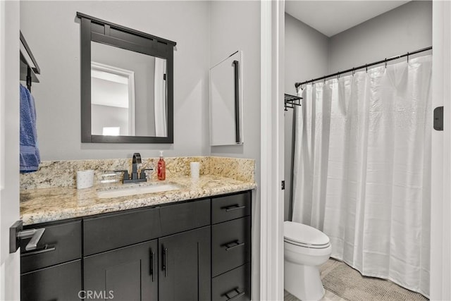 full bath featuring toilet and vanity
