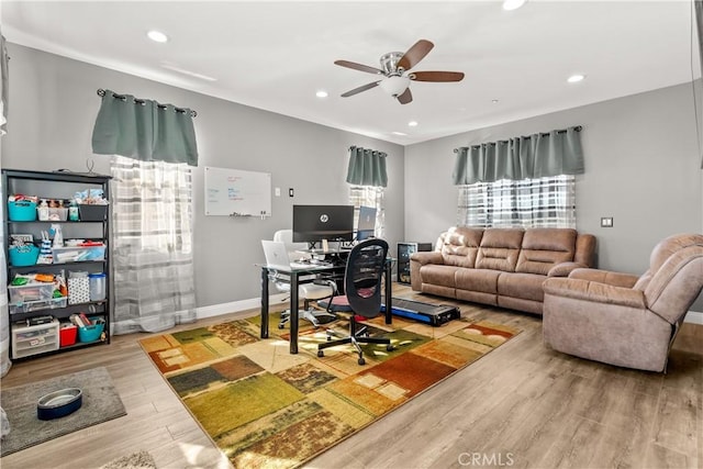 living room with recessed lighting, baseboards, a ceiling fan, and wood finished floors