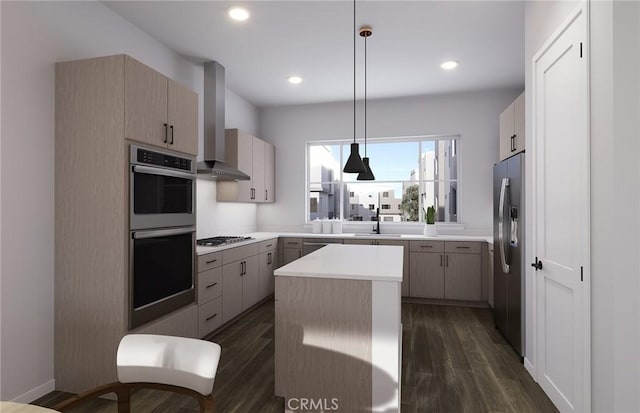 kitchen with appliances with stainless steel finishes, dark wood-type flooring, a center island, wall chimney range hood, and a sink