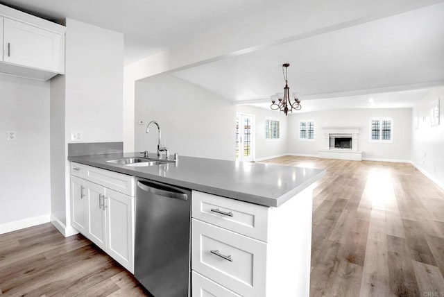 1331 Louden Ln, Imperial Beach, CA 91932 - kitchen featuring stainless steel dishwasher, a peninsula, open floor plan, and white cabinets
