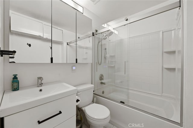 full bathroom featuring shower / bath combination with glass door, vanity, and toilet