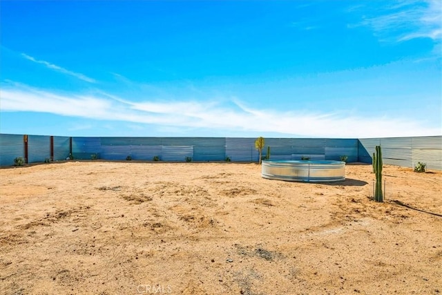 view of community with fence