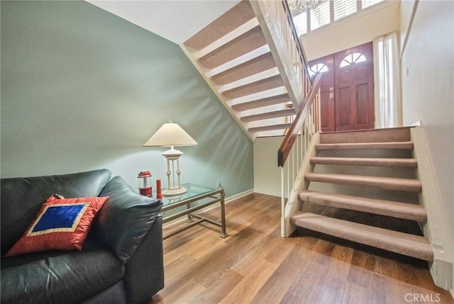 interior space with stairway and wood finished floors