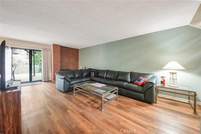 living room with light wood-style flooring and baseboards