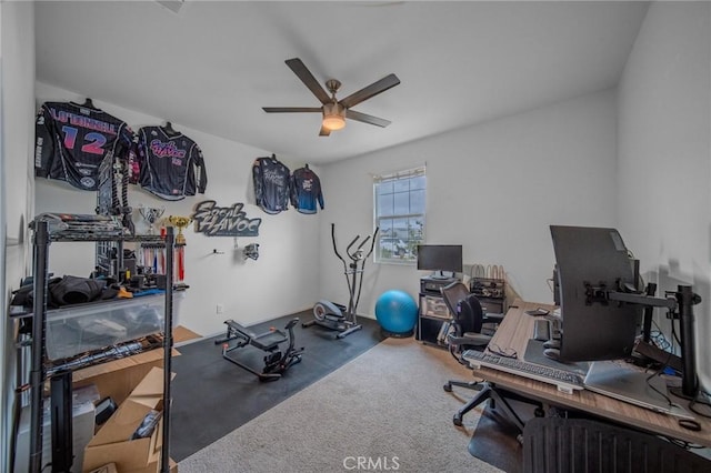 exercise room with carpet floors and a ceiling fan