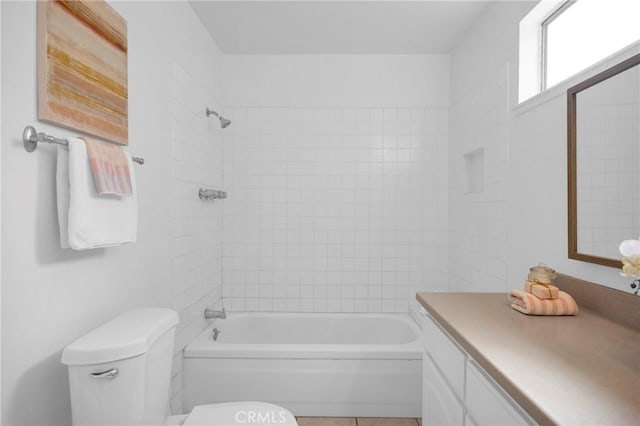 bathroom featuring vanity, toilet, and bathtub / shower combination