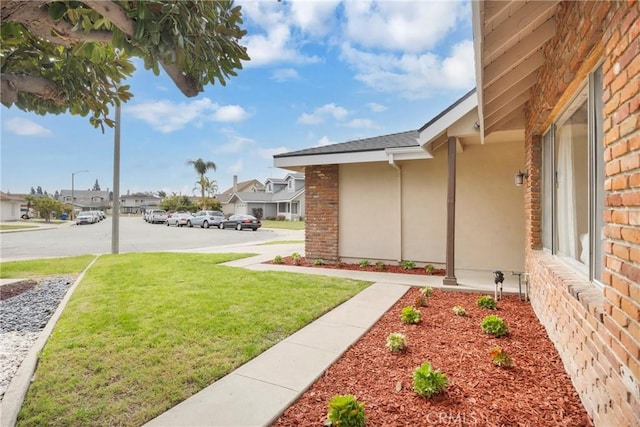 view of yard featuring a residential view