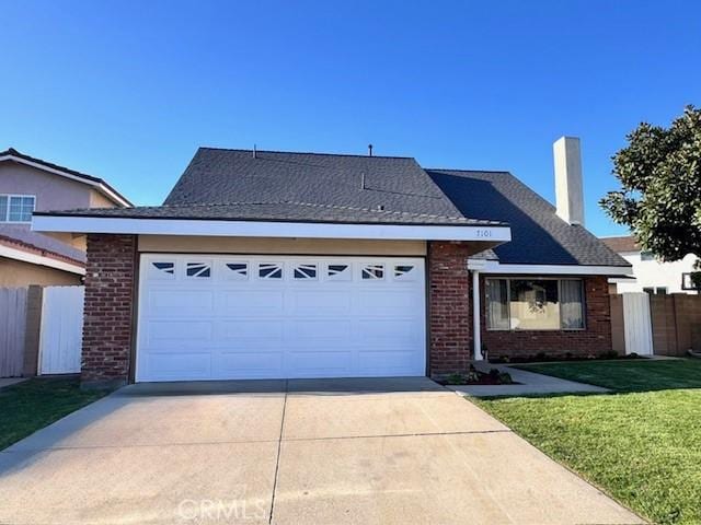 ranch-style home with fence, an attached garage, a front lawn, concrete driveway, and brick siding