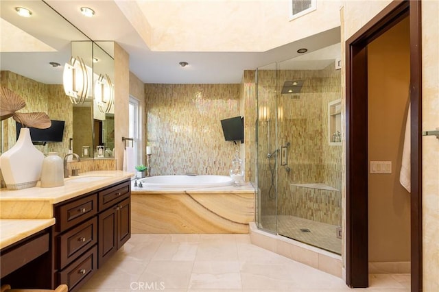 full bathroom featuring vanity, visible vents, a stall shower, a garden tub, and tile patterned floors