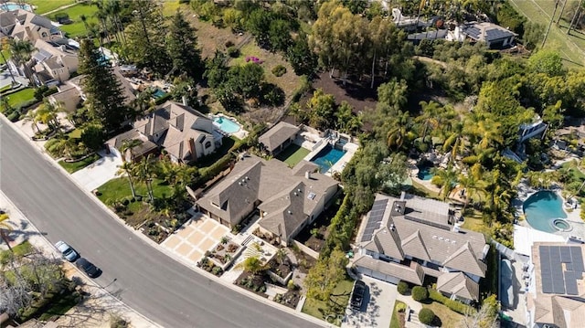 birds eye view of property with a residential view