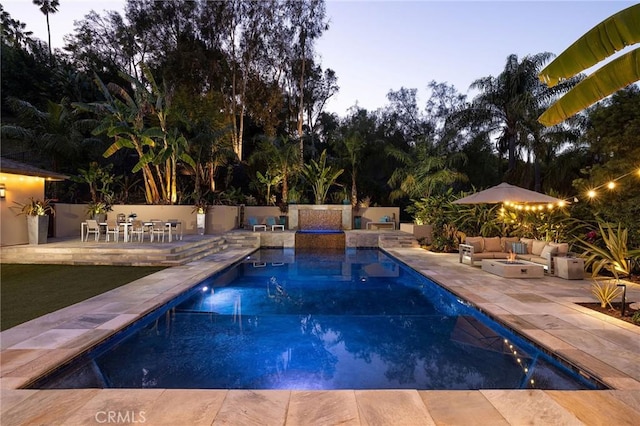 pool featuring a patio and fence