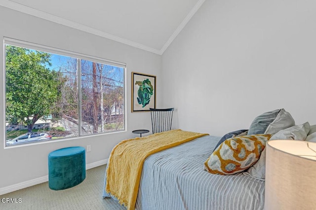 bedroom featuring carpet floors, baseboards, ornamental molding, and vaulted ceiling