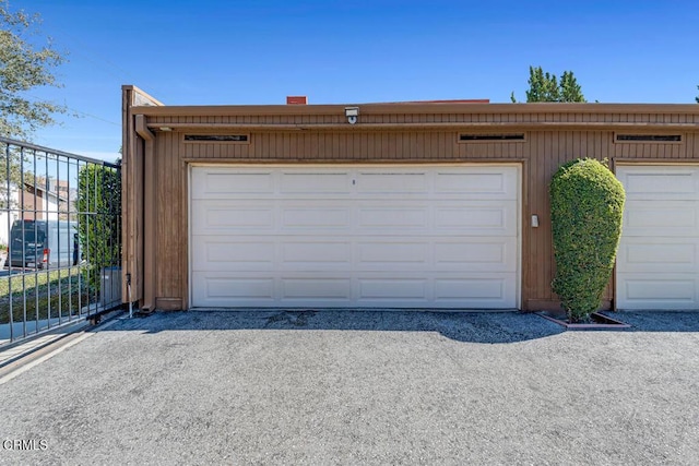 garage with fence