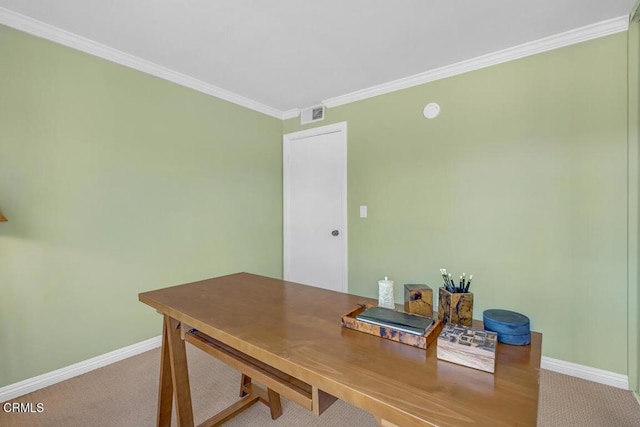 office featuring carpet floors, ornamental molding, visible vents, and baseboards