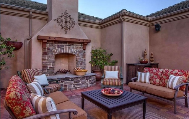 exterior space with an outdoor living space with a fireplace