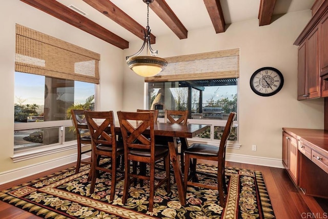 dining space featuring beam ceiling, baseboards, and dark wood-style flooring