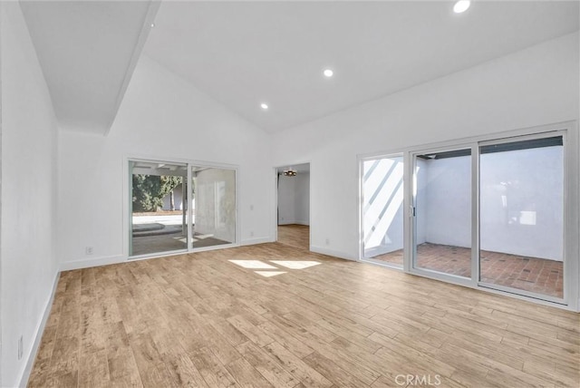 unfurnished bedroom featuring recessed lighting, light wood-style floors, high vaulted ceiling, access to outside, and baseboards