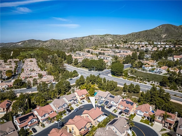 drone / aerial view featuring a mountain view and a residential view