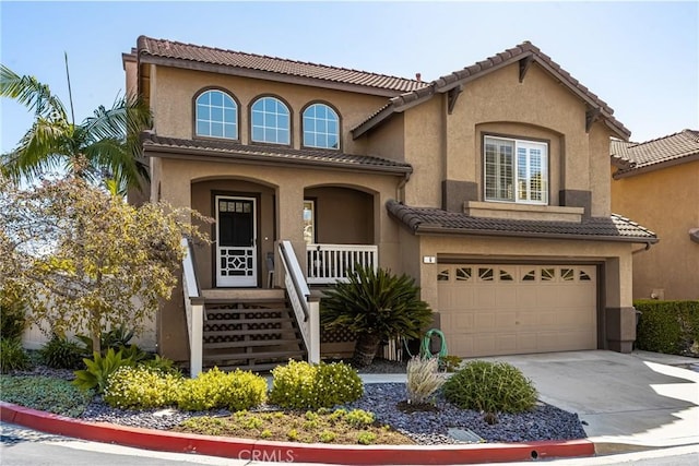 mediterranean / spanish-style house featuring a garage, covered porch, driveway, and a tiled roof
