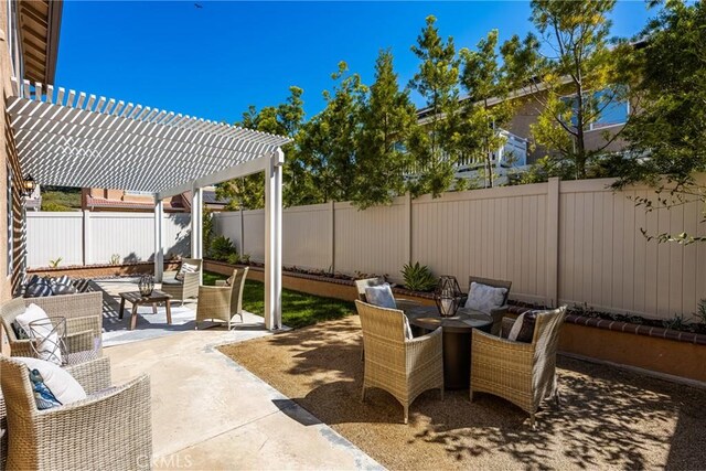view of patio / terrace featuring a fenced backyard and a pergola