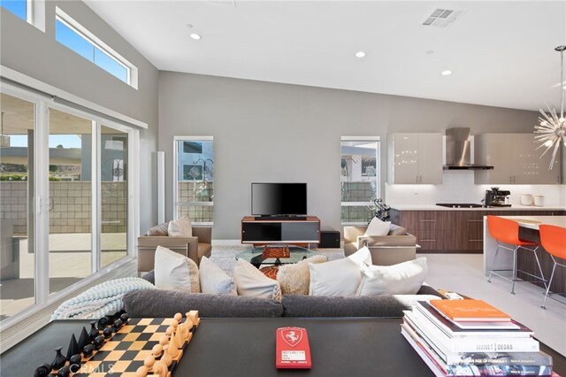 living room with recessed lighting, light carpet, and visible vents
