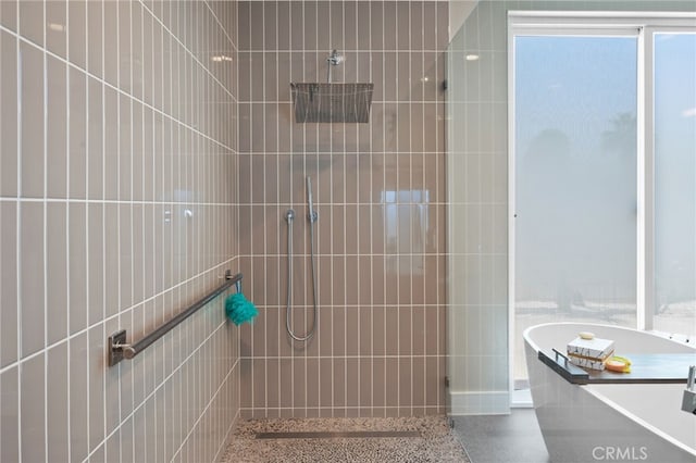 full bath featuring a tile shower