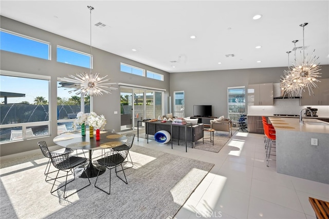 dining room featuring visible vents, an inviting chandelier, recessed lighting, and light tile patterned floors