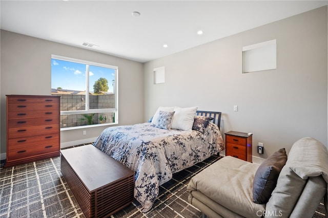 carpeted bedroom featuring baseboards, visible vents, and recessed lighting