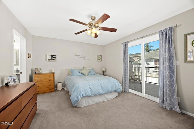 bedroom featuring access to exterior, a ceiling fan, and light colored carpet