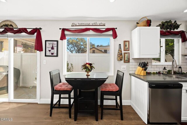 dining room with baseboards, dark wood-style flooring, and recessed lighting