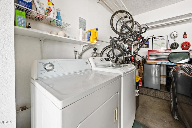 clothes washing area featuring laundry area and washing machine and dryer