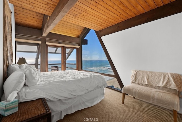 bedroom with wooden ceiling, carpet floors, a water view, access to outside, and beamed ceiling