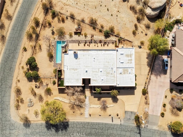 birds eye view of property featuring view of desert