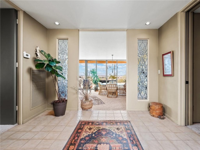 interior space featuring recessed lighting, visible vents, and baseboards