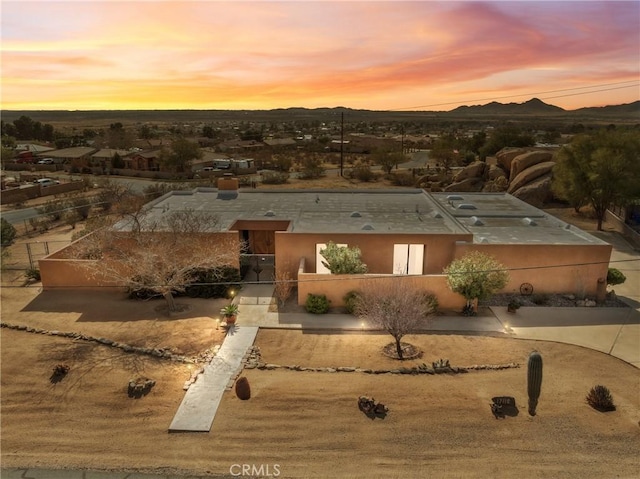 view of front of home featuring a mountain view