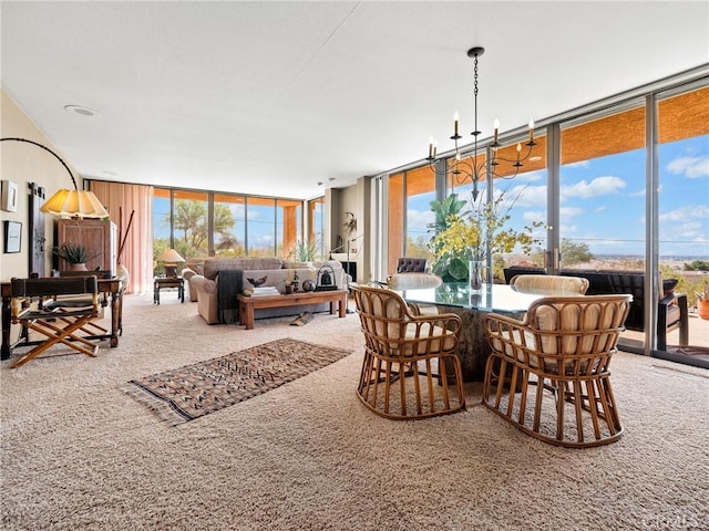 dining space with expansive windows, carpet flooring, a wealth of natural light, and a notable chandelier