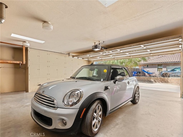 garage featuring a garage door opener