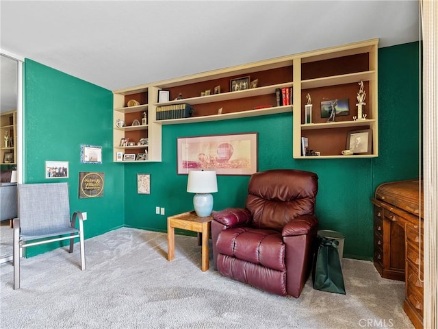 living area featuring carpet flooring