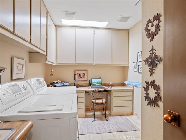 washroom featuring cabinet space and washing machine and clothes dryer