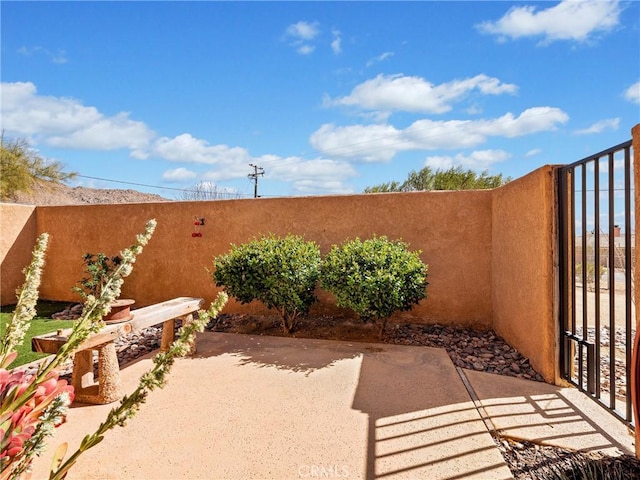 view of patio / terrace featuring fence